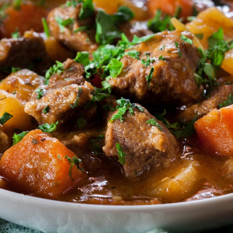 meat, potatoes, carrots, and broth in a slow cooker