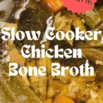 close up of chicken and vegetables simmering in a slow cooker