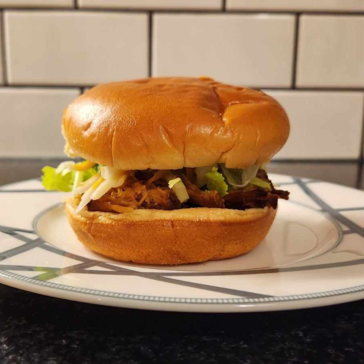 pulled pork sandwich on a plate