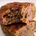 close up of two einkorn blondies stacked with a bite out of one