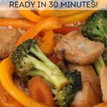 close up of chicken stir fry with text overlay that says "Healthy Chicken Stir Fry. Ready in 30 Minutes"