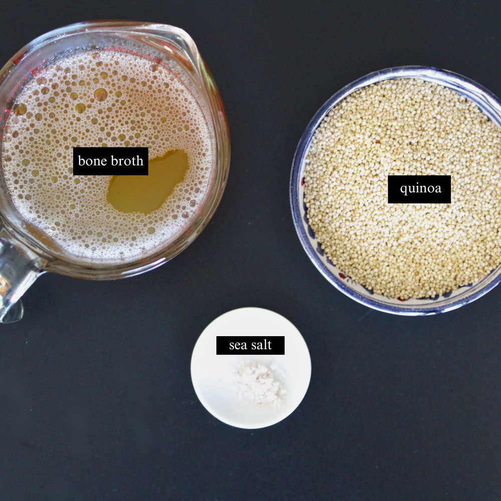 Labeled ingredients for quinoa recipe, including 1 cup of quinoa, 2 cups of bone broth, and 1/4 tsp sea salt. The ingredients are arranged on a kitchen counter with clear labels.