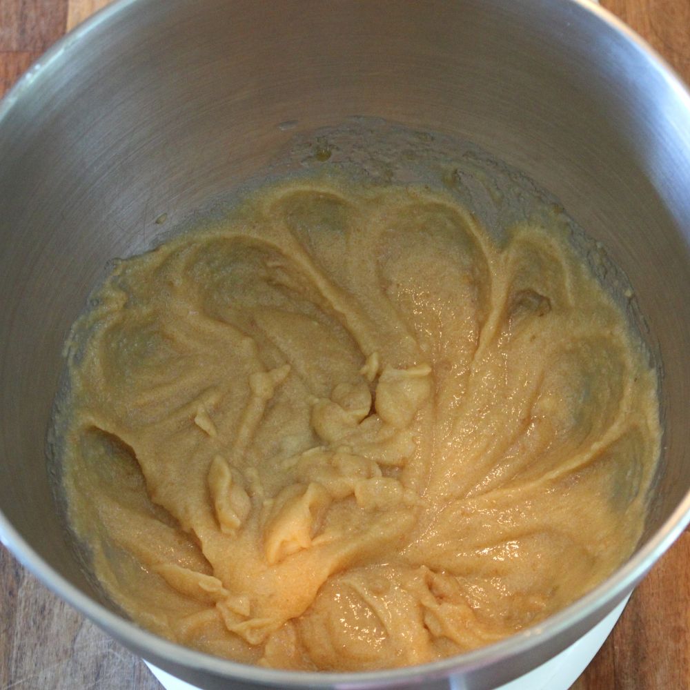 wet ingredients for white chocolate chip raspberry cookies mixed in the bowl of a stand mixer