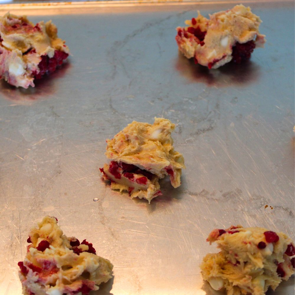 cookie dough balls on a baking sheet