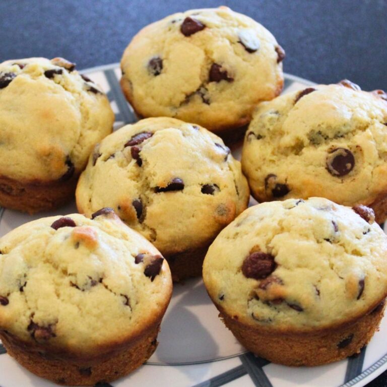 close up of homemade chocolate chip muffins on a plate