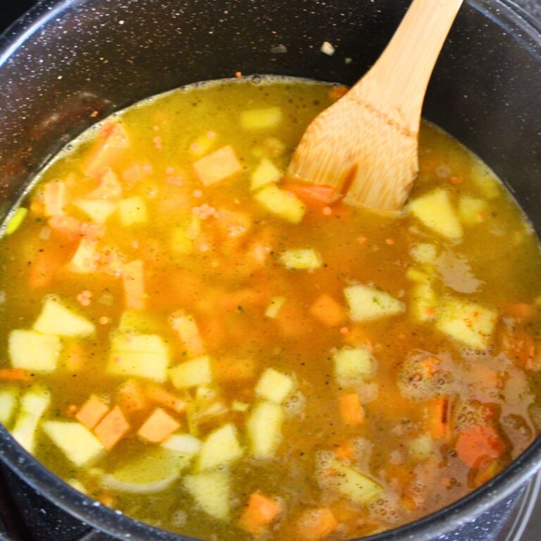 sweet potato red lentil soup cooking in a pot