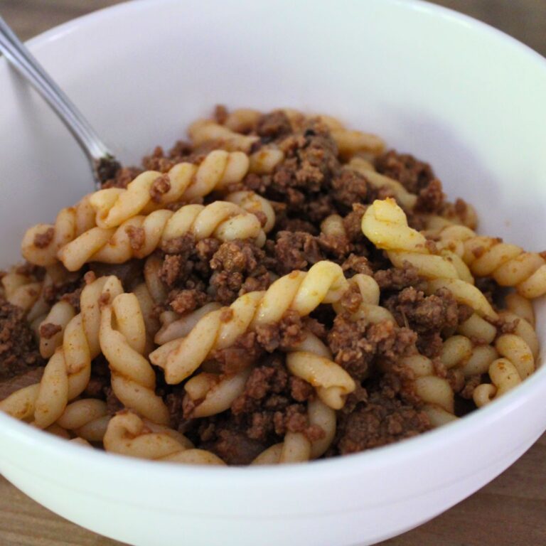 homemade hamburger helper in a bowl with a fork in it