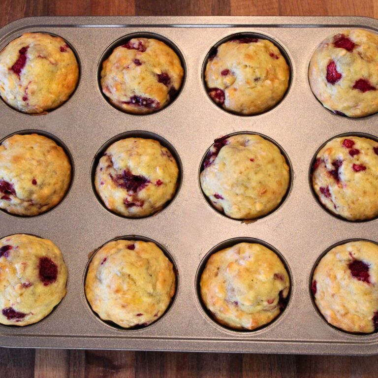 raspberry oatmeal muffins in a muffin pan