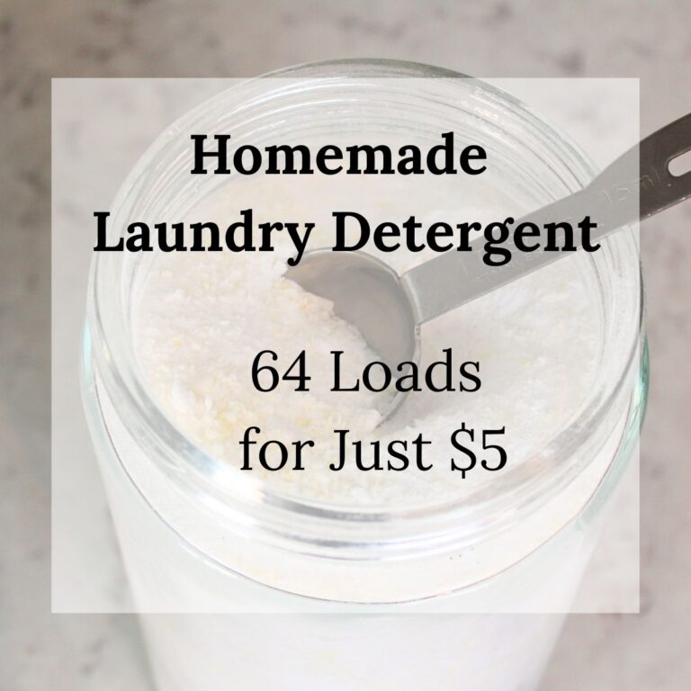 Overhead view of a glass jar filled with homemade powder laundry detergent, with a metal tablespoon scoop resting inside. Text overlay reads: "Homemade Laundry Detergent &ndash; 64 Loads for Just $5."