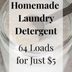Overhead view of a glass jar filled with homemade powder laundry detergent, with a metal tablespoon scoop resting inside. Text overlay reads: "Homemade Laundry Detergent – 64 Loads for Just $5."